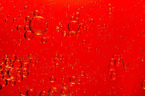 istock macro red bubbles,red macro bubbles,Backgrounds, Abstract Backgrounds, Soda, Red, Carbonated,Beauty concept background. Closeup cosmetic liquid gel with bubbles on red colors background 1484148578