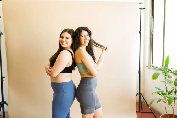 istock Happy fit women talking about body acceptance after exercising 1484149280