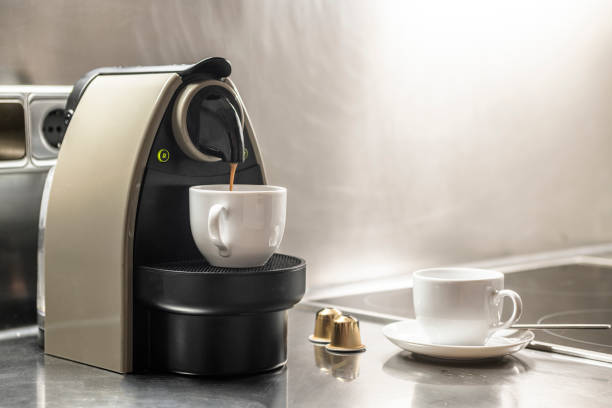 istock Preparing some homemade cups of coffee with a typical household machine 1484149480