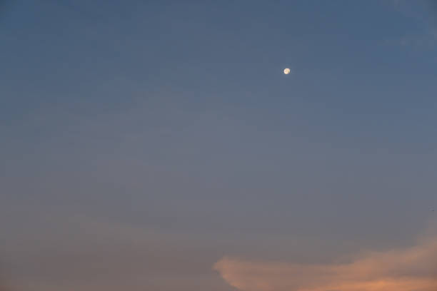 Beautiful colorful sunrise sky with cloud and moon