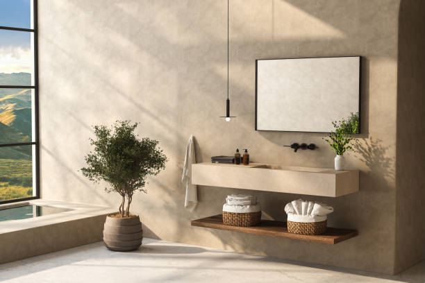 istock A minimalist bathroom with a sleek bathroom vanity, black and white bathtub, wall-mounted mirror, plants, matte marble flooring, beige walls, and a small pool. 3d rendering 1484157894