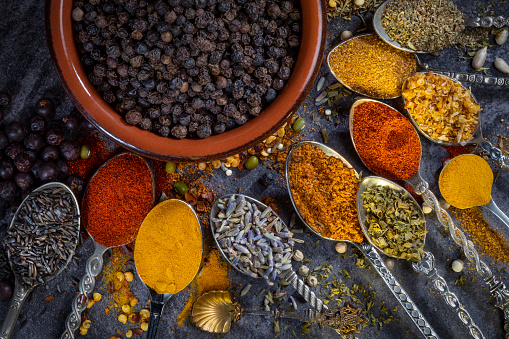 Selection of spices used to add flavor and seasoning to food during cooking.