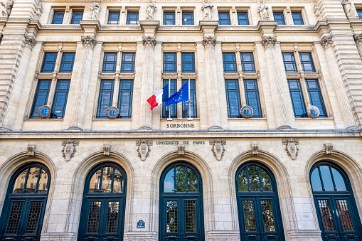 Paris, France - April 21, 2023: Exterior view of the facade and main entrance of the Sorbonne, famous French university located rue des Ecoles in Paris, France