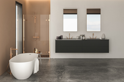 Modern bathroom with luxurious cabinet, white bathtub, shower cabin, window, and concrete floor, featuring beige and white walls for a sleek and sophisticated look.3d rendering