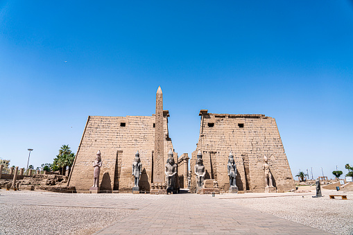 Landscape of the entrance of Luxor Temple in a sunny day with blue sky.