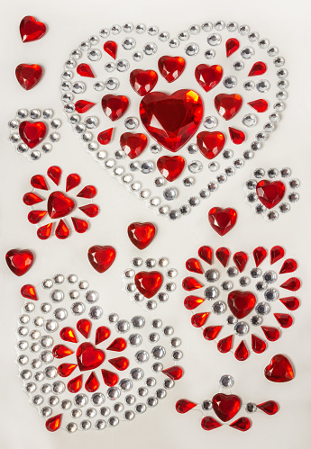 Romantic stickers for Valentine's Day: red crystalline hearts, red and silver rhinestones.