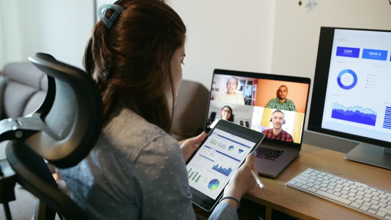 Woman working from home and having video conference.Bank manager.Using technology.