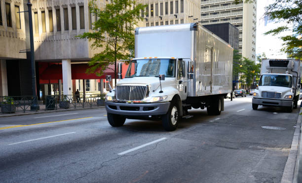 istock White semi truck driving. 1484165975