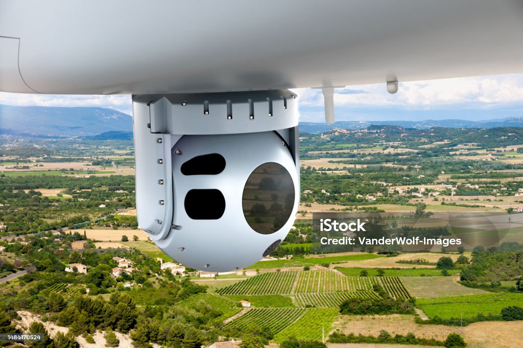 Camera sensor pods under an unmanned aerial surveillance Camera sensor pods under an unmanned aerial surveillance drone aircraft. Military Stock Photo
