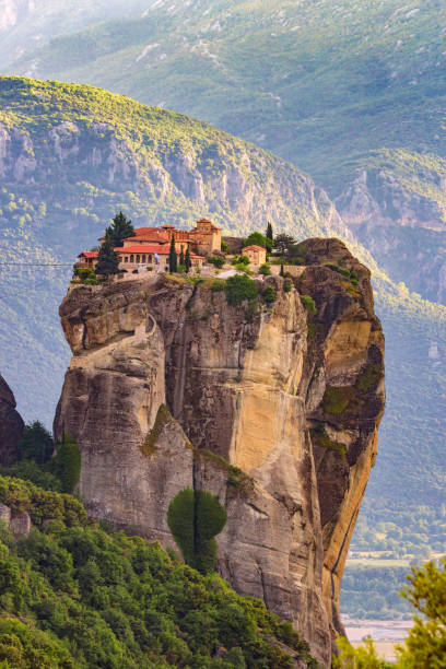 Meteora landscape with monastery on a monolithic pillar.