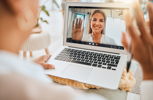 Laptop, video call and mental health with wave hello in virtual counseling consultation, doctor and patient in communication Psychologist, depression and women, trauma and anxiety, support and trust