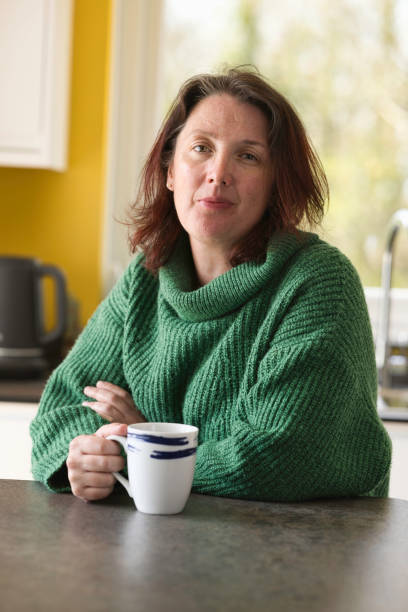 istock Middle-aged lady enjoying a coffee break 1484176377