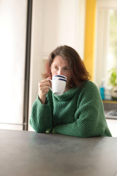 istock Middle-aged lady enjoying a coffee break 1484176416