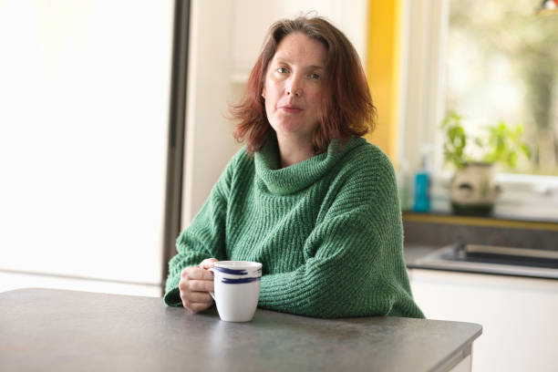 istock Middle-aged lady enjoying a coffee break 1484176454