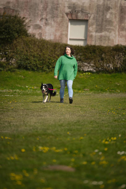 istock Caucasian lady out for a walk in the park 1484177853
