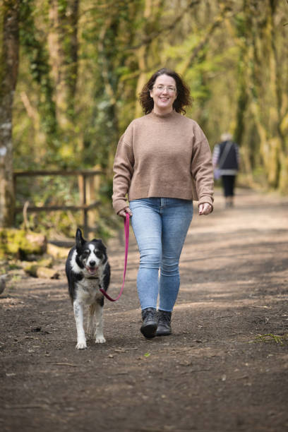 istock Caucasian lady out for a walk in the park 1484177936