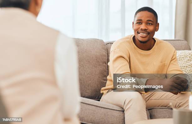 Black Man Counseling And Psychology Consulting For Therapy Mental Healthcare Or Support Happy Patient Talking To Psychologist Therapist And Medical Help In Consultation Advice And Wellness Check Stock Photo - Download Image Now