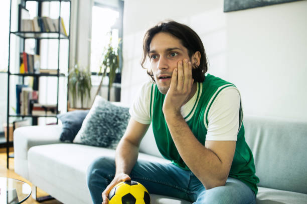 istock Man enjoying and watching TV 1484179596