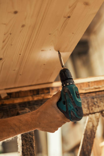 istock Carpenter's hand, electric screwdriver 1484183166