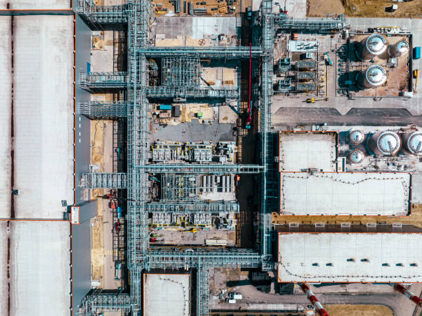 istock Construction site from above. Top view of factory under construction with heavy machinery. Picture made by drone from above. 1484187266