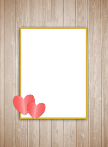 Frame with hearts on wooden plank background. stock photo
