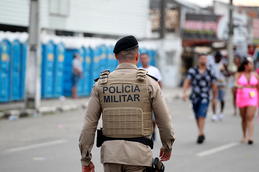 feira de santana, bahia, brazil - april 21, 2023: Military Police officers work on the security of revelers during the micareta in the city of Feira de Santana.