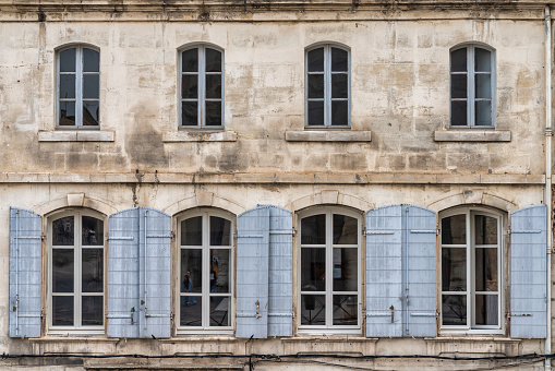 This photo showcases the exquisite architecture of a Renaissance-style building in Arles, France. The image captures the intricate details of the building's facade, including the elegant arches, ornate carvings, and decorative moldings. This photograph is perfect for use in architecture and travel publications, highlighting the beauty and cultural significance of Renaissance-style buildings. It can also be used as a decorative piece, adding a touch of sophistication and elegance to any interior design project.