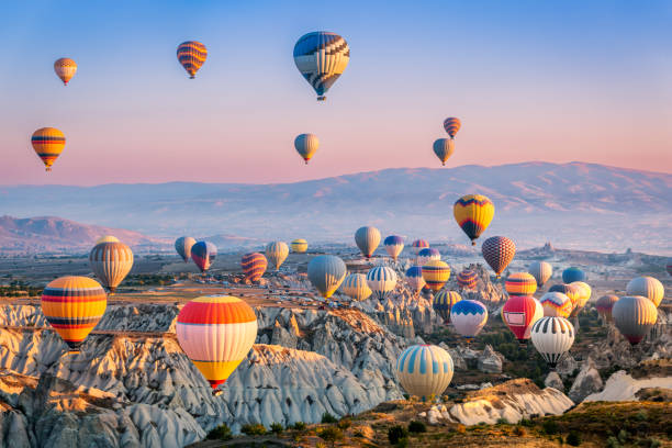 Aerial view of a fleet of hot air balloons, in Cappadocia, Turkey stock photo
