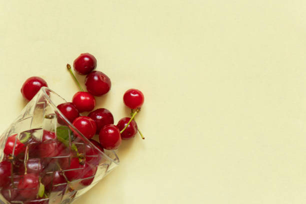 istock ripe cherries in a glass on a red background close-up 1484201225