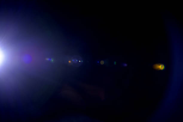istock glare from a lantern with rays of light in the dark as a background 1484201502