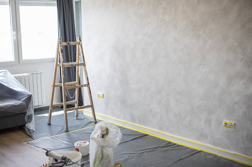 Ladder placed in a room under reconstruction