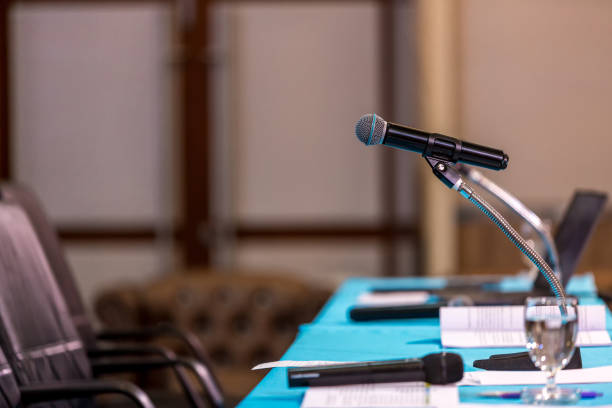 istock Microphone in concert hall or conference room soft and blur style for background. 1484204698