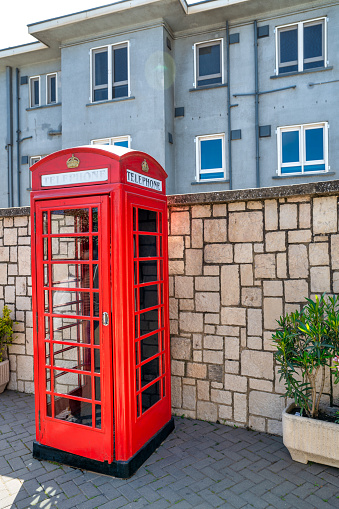Iconic british old red telephone box at the entrance in Gibraltar.