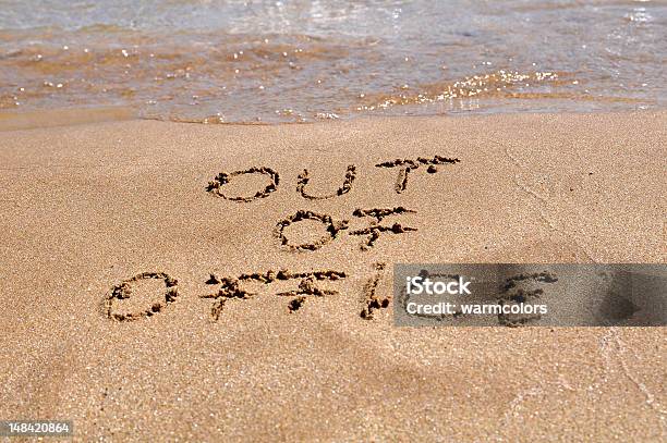 Out Of Office Message Written In The Sand Of A Beach Stock Photo - Download Image Now