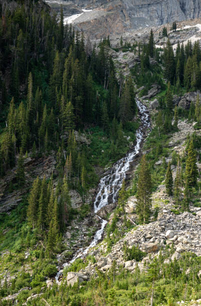 Paintbrush Cascade Tumbles Over Cliffs and Mountainside into Green Valley in Grand Teton National Park