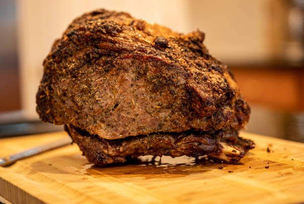 istock Prime Rib Roast Rests On Cutting Board 1484213516