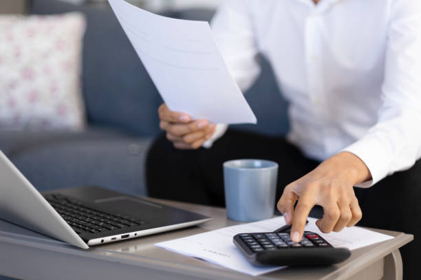 istock Unrecognizable businessman calculating bills 1484213636