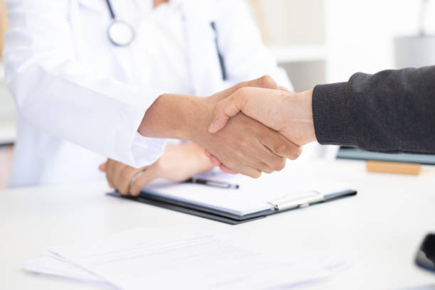 istock Close-up Doctor and patient shaking hands 1484213686
