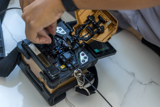 istock Optical fiber installation with Digital Fiber Optical Fusion Splicing machine. 1484214138