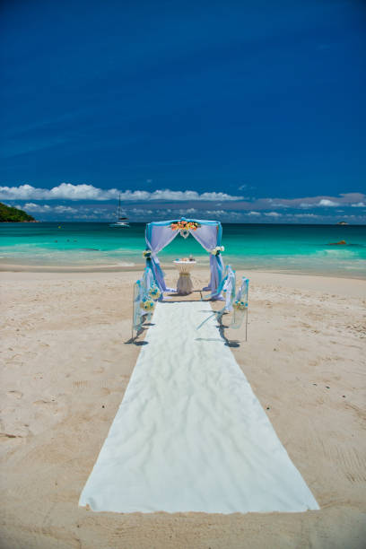 Wedding gazebo setup. Destination wedding on a white sand beach during summer. Exotic wedding on an isolated island.