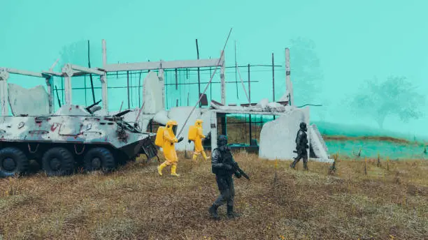 Workers in radiation protection suits are escorted through a dangerous area by soldiers holding weapons. Maybe they are worried about a virus, maybe it is radiation or some sort of biochemical warfare. A destroyed building is in the background.