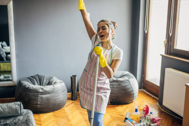 istock A young woman cleaning the apartment 1484224335