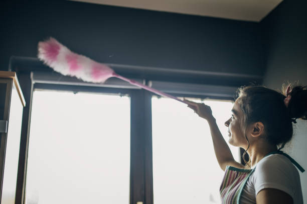 istock A young woman is cleaning 1484227203