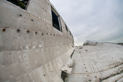 Exterior of airplane, wreckage from an airplane crash in Iceland on Solheimasandur black sand beach.