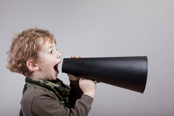 istock Blonde Haired Cute Little Boy Shouting On Old Fashioned Megaphone 148423211