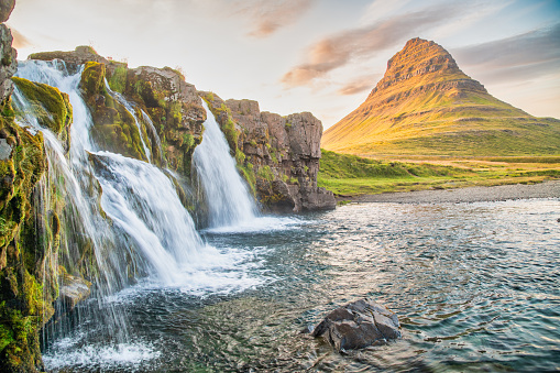 Kirkjufellfoss waterfalls at summer sunset, Iceland.