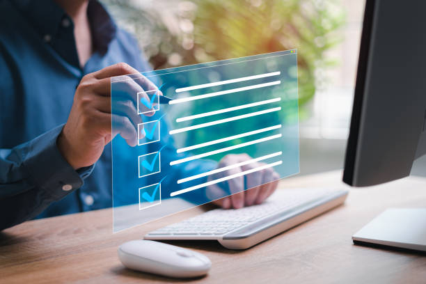 istock Smart digital checklist on virtual screen concept, Businessman marking about exploring the topics on the checklist with use in desktop computer management document in business work 1484242094