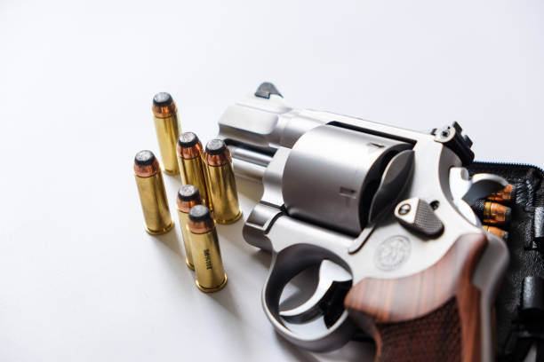 istock .44 magnum revolver gun with bullet on white background 1484243364
