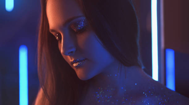 istock neon portrait glitter makeup woman sparkling face 1484245284