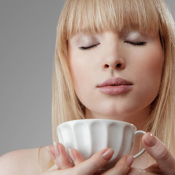 istock Young woman with tea 148425389